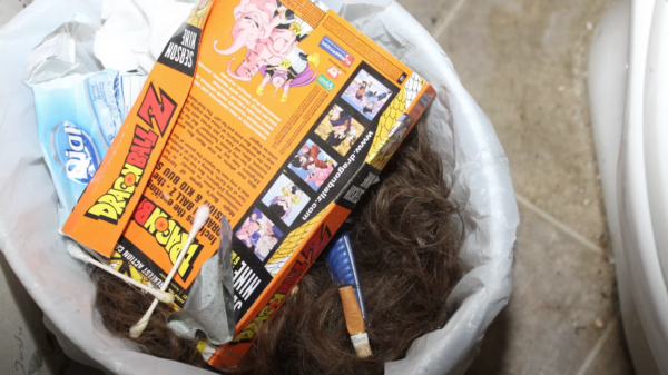 hair is seen in a trash can